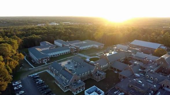 Aerial view of the CATS Academy Boston campus at sunset
